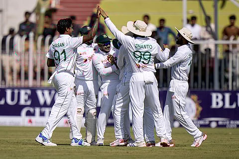 Pakistan vs Bangladesh 1st Test Day 1: Bangladesh's Hasan Mahmud, left, celebrates with teammates after taking the wicket of Pakistan's Abdullah Shafique